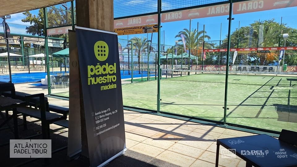 View through the glass onto the green courts